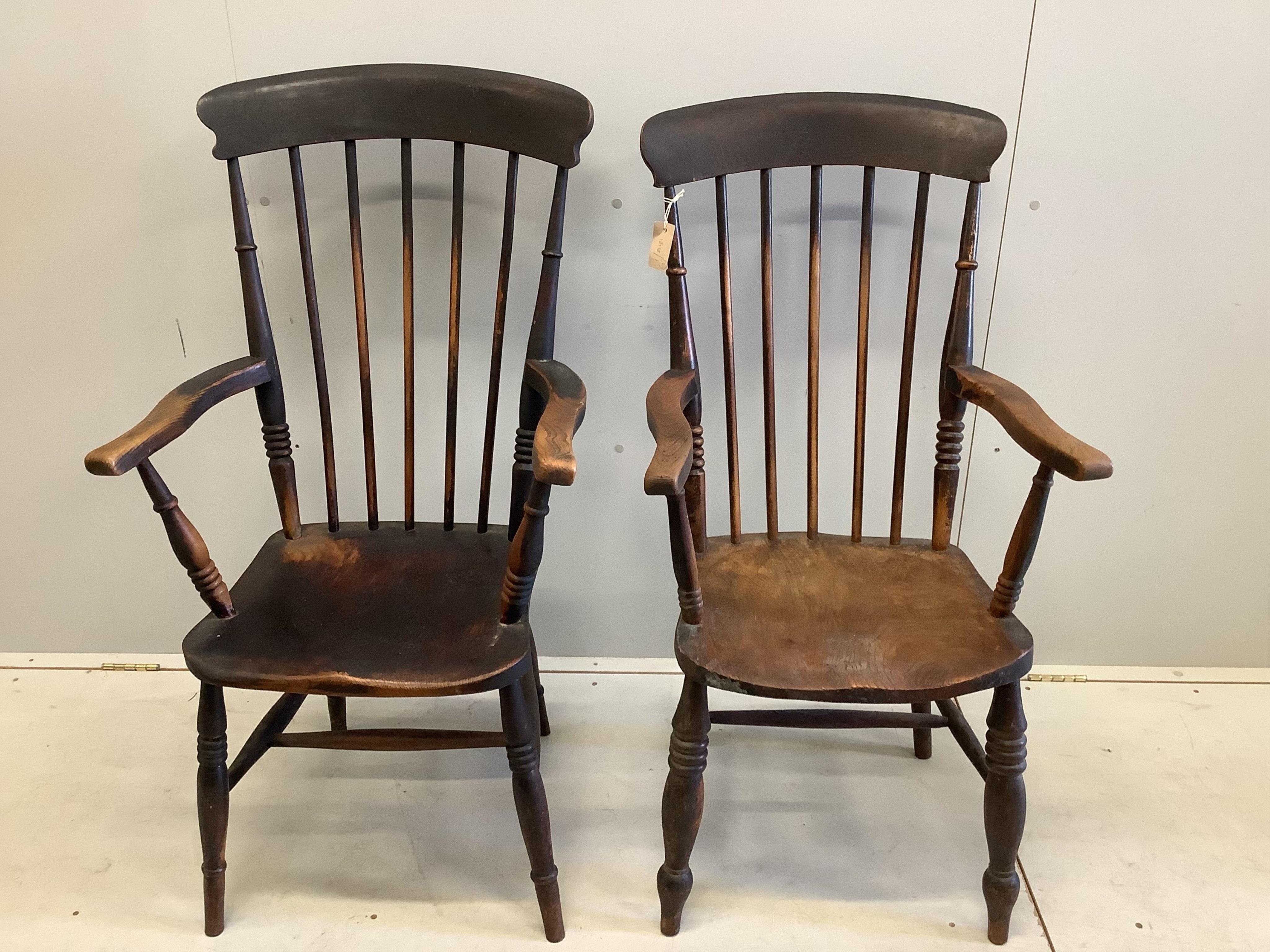 Two Victorian elm and beech Windsor comb back armchairs, larger width 58cm, depth 43cm, height 111cm